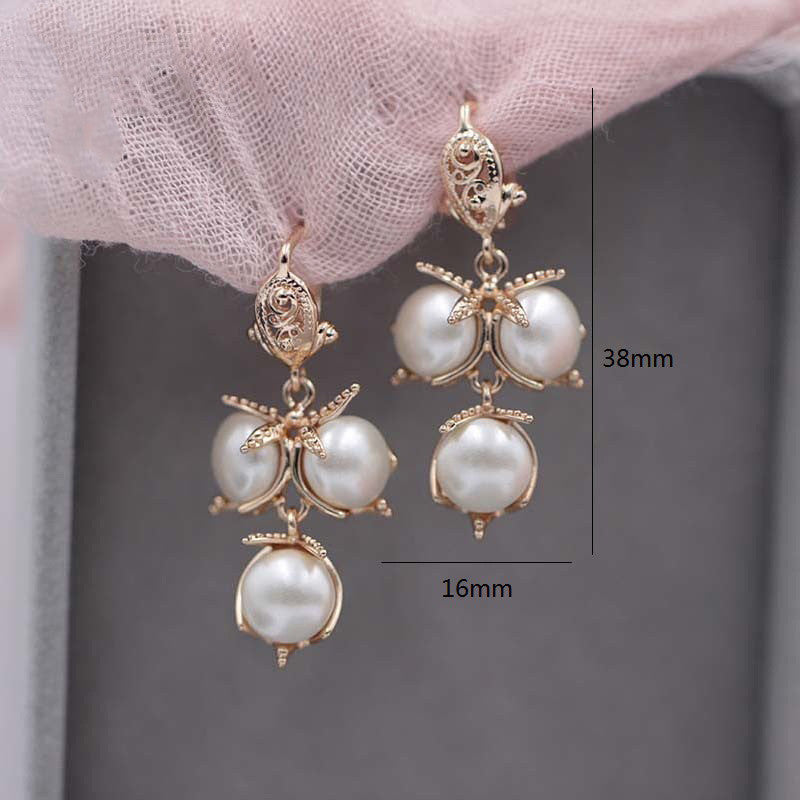 Ladies Flame Rose Gold Shell Pearl Earrings